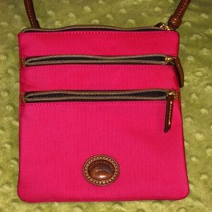 Dooney and Bourke North to South triple zipper hot pink crossbody bag